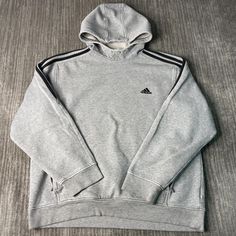 Vintage 2000s Adidas Two Pockets Three Stripes Sportswear Athletic Y2K Aesthetic Grey Graphic Hoodie Extra Large Mens Condition:  Fair Used Condition  = Staining On The Front Of The Sweatshirt Due To Age And Wear  Measurements: Please see photos above for all measurements IF YOU BUY TWO OR MORE ITEMS USE THE CODE BUNDLE @ CHECK TO SAVE 20% WE SHIP WITHIN 24 HOURS AFTER PURCHASE! Please be aware that we do not offer free returns!! The Buyer is responsible for the cost of the return label. Follow Grey Graphic Hoodie, 2000s Adidas, Aesthetic Grey, Vintage 2000s, Y2k Aesthetic, Graphic Hoodie, Graphic Hoodies, Extra Large, Adult Outfits