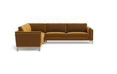 a brown couch sitting on top of a white floor