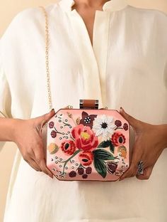 This is one of a kind handcrafted bag which is hand-embroidered to order. As it is a handcrafted product, it may have slight irregularities or imperfections.  MEASUREMENTS Length - 17.78cm Width - 17.78cm Handle - 116.84cm This clutch can be worn as a crossbody bag or a shoulder bag with the sling chain or can simply be carried in hand. It is spacious enough to carry mobile phones, cosmetics, keys and other small accessories. It's a beautiful ornamented piece to carry to weddings, parties and ot Rectangular Bag With Multicolor Embroidery And Hand-stitched Details, Hand-stitched Rectangular Bag With Multicolor Embroidery, Embroidered Rectangular Clutch For Festivals, Pink Rectangular Shoulder Bag With Handwork, Pink Embroidered Handheld Bag, Pink Floral Embroidered Clutch Bag, Pink Rectangular Shoulder Bag For Festive Occasions, Handmade Multicolor Embroidered Shoulder Bag As Gift, Handheld Multicolor Bags With Handwork