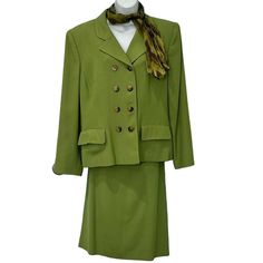 Vintage Kaspar Grass Green Blazer Pencil Skirt Suit Plus Size 16 Double Breasted Vintage 2 piece set in a grass green color - the flat lay is the best approximation of the color. Matching scarf included! Skirt is knee length. The suit is from the 80s or 90s. Both tags (blazer and skirt) say size 16. Double breasted blazer with shoulder pads. Excellent preowned condition and ready to wear! All measurements are approximate and pictured in the photos so you can see how the item was measured. Blazer: Bust: 21" pit to pit / 42 inches full bust Length: 26 inches Skirt: Waist: 17" laying flat / 34" full waist Length: 25" waist to hem corpcore, corporate, businesswear, workwear, retro, powersuit, business, vintage, careerchic, businessformal, wallstreet Classic Fitted Green Skirt Suit, Classic Green Fitted Skirt Suit, Elegant Green Skirt Suit For Workwear, Green Fitted Skirt Suit For Formal Occasions, Green Office Sets For Spring, Spring Green Fitted Skirt Suit, Fitted Green Skirt Suit For Spring, Fitted Green Sets For Workwear, Green Long Sleeve Formal Skirt Suit