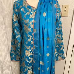 Pakistani Indian Three Piece Beautiful Formal Dress.Fabric Pure Jamawar.Silk.Shalwar Is Pure Silk.Shirt And Have Pink Piping.Shirt Have Lining.Sz Approx Bust 21”Waist 19”Hips 21.5”Length 43”Arm 23.5”Shalwar Length 38”Brand New..Color Teal. Gold Long Sleeve Slub Silk Kurta, Bollywood Style Long Sleeve Slub Silk Dress, Diwali Long Sleeve Slub Silk Dress, Fitted Cotton Silk Palazzo Set With Long Sleeves, Long Sleeve Slub Silk Dress For Diwali, Fitted Long Sleeve Cotton Silk Palazzo Set, Bollywood Style Long Sleeve Salwar Kameez In Slub Silk, Cotton Silk Churidar With Sheer Dupatta, Long Sleeve Cotton Silk Churidar With Sheer Dupatta