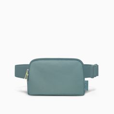 a small blue belt bag on a white background