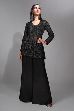 Black sheer peplum kurta featuring bead and sequin embellished floral motifs. Paired with a silk satin sharara and an inner blouse., Fit: Relaxed Elegant Resham Embroidered Peplum Palazzo Set, Elegant Eid Palazzo Set With Peplum Top, Elegant Peplum Palazzo Set With Resham Embroidery, Elegant Peplum Sets With Mirror Work, Elegant Zari Work Peplum Palazzo Set, Elegant Peplum Palazzo Set With Zari Work, Elegant Embellished Peplum Anarkali Set, Elegant Designer Peplum Sharara, Elegant Peplum Anarkali Set With Mirror Work