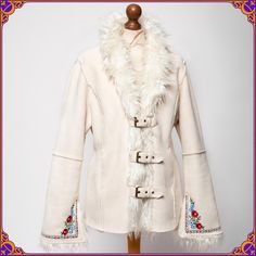 The ultimate vintage 70s style vegan afghan coat with the the most beautiful embroidery. Definitely much more stunning in person! Size  ⫸ Excellent pre-loved vintage condition! Clean and without any stains or odors 🌸 ⫸ Fabric: shell- polyester/acrylic // 100% genuine vegan faux fur/ Lined with faux fur ⫸ Ultra soft and cozy ⫸ 🌸100% VEGAN 🌸 ⫸ two front pockets ⫸ Beautiful embroidered details  ⫸ Ready to ship ✌ From Poland with love ˗ˏˋ ♡ ˎˊ˗ *Worldwide shipping via DHL EXPRESS (1-5 days) ❁ ❀ ? Bohemian Winter Outerwear, Hippie Style Outerwear For Spring Festival, Hippie Style Festival Outerwear For Spring, Fitted Bohemian Outerwear With Floral Embroidery, Beige Winter Outerwear With Floral Embroidery, Beige Floral Embroidered Winter Outerwear, Folk Style Embroidered Outerwear For Fall, Winter Long Coat With Floral Embroidery, Winter Floral Embroidered Long Coat