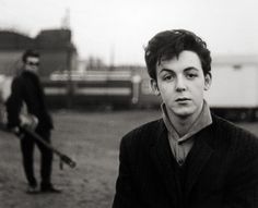 black and white photo of two men with guitars