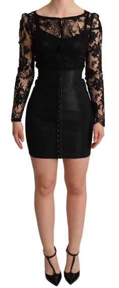 Explore timeless elegance and Italian craftsmanship with this stunning, brand new piece by Dolce & Gabbana. A vision in black, this fitted mini-dress captivates with its illusion of a long-sleeve lace top over a sleek bodysuit, fastened with hidden hooks. The rear zipper closure ensures a seamless silhouette, while the silk stretch lining offers luxurious comfort. It’s a statement garment that signifies exclusivity and exquisite workmanship. Color: Black Material: 52% Nylon, 30% Cotton, 8% Elast Luxury Fitted Mini Dress, Fitted Mini Corset Dress For Evening, Fitted Mini-length Evening Corset Dress, Black Fitted Mini Corset Dress, Fitted Knee-length Mini Skirt For Club, Luxury Black Bodycon Dress For Evening, Elegant Club Mini Dress, Elegant Mini Dress For Club, Black Fitted Mini Length Corset Dress