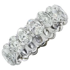 Exquisite Vivid Diamonds eternity band crafted in Platinum, showcasing 17 stunning GIA certified oval diamonds weighing 5.35 carats total, D-E color, VVS-VS clarity. Each diamond was carefully selected, perfectly matched and set in a seamless sea of eternity, creating a spectacular symphony of brilliance and fire. This sensational band measures 5.3 mm in width. It weighs 6.4 grams and is a size 7. This spectacular band was designed to sit low on the finger for maximum comfort. Our pieces are all 7 Carat Diamond Ring, Asher Cut Diamond, Oval Eternity Band, Memory Ring, Engagement Rings Romantic, Modern Wedding Rings, Emerald Cut Diamond Ring, Expensive Jewelry Luxury, Asscher Cut Diamond