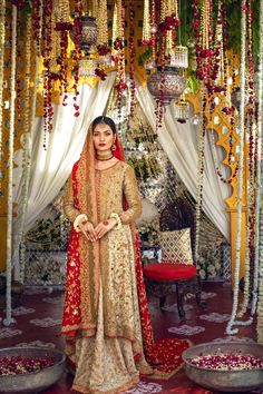 a woman standing in front of a decorated stage