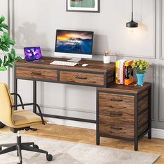 a desk with a computer on top of it and a chair next to the desk