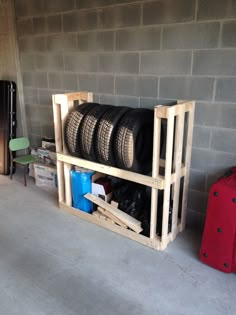 a room with some shelves filled with tires