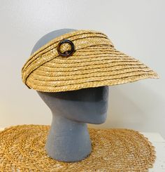 "An absolutely perfect vintage straw sun visor, beach hat, straw with a little celluloid circle clip. Cool festival hat, iconic 60s style.  Brim measures 14\" in diameter, stretches to fit about any head. Good clean condition, BUT A LITTLE YELLOWING ON INSIDE OF BAND." Retro Summer Vacation Straw Hat, Adjustable Retro Straw Hat For Vacation, Retro Adjustable Straw Hat For Vacation, Retro Wide Brim Sun Hat For Vacation, Retro Summer Vacation Sun Hat, Retro Brimmed Sun Hat For Vacation, Retro Curved Brim Straw Hat For Beach, Retro Wide Brim Sun Hat For Summer, Retro Wide Brim Straw Hat For Beach