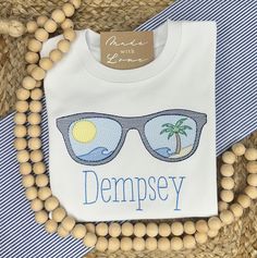 Stay cool with this fun summer shirt! Available with pink or blue sunglasses. When ordering an embroidered item, please specify your desired design, monogram initials or name, monogram font & thread color. All of the monogram options can be found here. Also, please make sure to select the clothing or other blank item prior to adding this item to your cart. Also, please note any special requests in the box provided. We will try our best to comply. Summer Short Sleeve Tops With Uv Protection, Summer Tops With Uv Protection And Short Sleeves, Blue Embroidered T-shirt For Summer, Trendy Embroidered Summer T-shirt, Summer Vacation Tops With Uv Protection, Casual Tops With Uv Protection For Beach Season, Casual Uv Protection Tops For Beach Season, White Embroidered T-shirt For Summer, Blue Summer Tops With Uv Protection