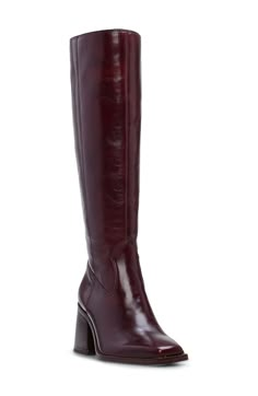 A contemporary square toe and flared block heel balance a versatile boot that will flawlessly complement your polished wardrobe. 2 3/4" heel (size 9) 15 1/2" shaft; 14 1/2" regular calf circumference 15 1/2" shaft; 16" wide calf circumference Leather upper/synthetic lining and sole Made in Brazil 90s Heeled Boots, Flat Burgundy Boots, Knee High Wide Calf Boots, Knee High Fall Boots, Square Toe Tall Boots, Dark Brown Platform Boots, Sangeti Boot Outfit, Red Tall Boots, Red Brown Boots