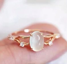 Add a touch of magic to your look with our 14k gold plated Moonstone Ring. This ethereal ring features a stunning moonstone that will catch the light at every angle. Perfect for everyday wear or special occasions. Shine bright like the moon! Ring Moonstone, Moonstone Engagement Ring, Traje Casual, Cubic Zirconia Rings, Men's Jewelry Rings, Copper Rings, Cross Earrings, Elegant Ring, Moonstone Ring