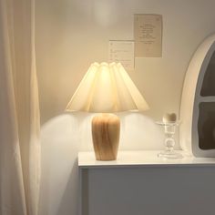 a table lamp sitting on top of a white counter