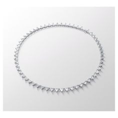 This necklace is precision-engineered from a uniform row of triangle step-cut clear stones. It is set on a silver tone plated fluid chain that is finished with a small lobster clasp fastening. A piece to keep and wear forever, this is your new go-to necklace for timeless elegance day or night. This necklace is part of the Millenia family, designed by Creative Director Giovanna Engelbert for Collection I.Dimensions: Length: 14 7/8 inchesPlating: Rhodium platedcolor: White Swarovski Millenia, Step Cut, Clear Stone, Creative Director, Rhodium Plated, Lobster Clasp, Sale Items, Diamond Necklace, Timeless Elegance