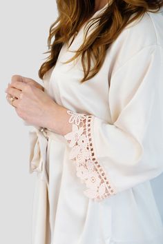 Champagne Elegant Long Sleeve Lace Sleepwear, Cream Wedding Sleepwear With Lace Trim, Elegant Wedding Robe With Lace Cuffs, Cream Lace-trim Sleepwear For Wedding, Elegant Lace Trim Sleepwear For Loungewear, Elegant Delicate Lace Robe For Wedding Night, Elegant Cream Robe For Wedding Night, Elegant Lace Robe With Lace Cuffs, Elegant Wedding Night Robe With Delicate Lace