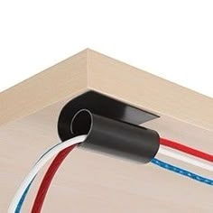 an electrical device is connected to two wires on the side of a wooden structure with red, white and blue wires