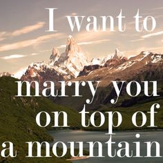 a mountain range with the words i want to marry you on top of a mountain