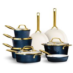 a set of blue pots and pans with gold handles