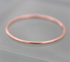 Rose Gold Skinny Ring * 1mm thick * Solid 14k Rose Gold * Shiny Polished Finish * Available in most full, 1/2 or 1/4 Sizes Simple round gold band. Band is 18ga 14k solid rose gold.  1mm wide very thin but strong. It is cut, soldered, tumbled and polished by me in my studio. Very sweet little ring to be worn alone or stacked with other rings.  Please specify ring size at checkout. Please be sure of ring size, I can send you a sizer, or you can be sized at any jewelry store. Skinny rose gold ring Single Diamond Ring, Midi Rings Gold, Chain Ring Gold, 14k Rose Gold Wedding Ring, Wedding Rings Round, Gold Rings Simple, Stacking Bands, Rose Engagement Ring, Rose Gold Band