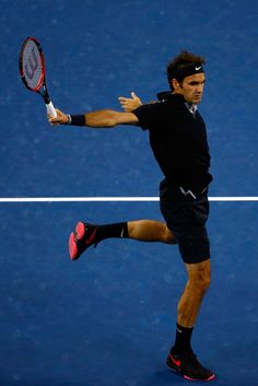 a male tennis player in action on the court