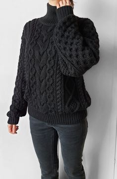 Gorgeous cable knit oversize sweater. 100% handmade ❤ Perfect quality.  The composition is 50% alpaca, 50% merino wool  Color: black  Collar: stand  Measurements of the sweater on the photo: - sweater width - 55 cm / 21.6 in - sweater length - 63 cm / 24.8 in - sleeve length (from neck to wrist) 70 cm / 27.5 in - collar length 11 cm / 4.3 in  I can make a custom SIZE according to your measurements. If you need change sweater width, sweater length, sleeve length or collar length please let me know.  If you would like another COLOR for your sweater please let me know.  Your sweater will be 100% handmade. Please, allow me 2 weeks to knit and ship out.  Free worldwide shipping If you have any quetions, please, send me message 😊   Dear knitters! Please do not use my photo to advertise your wor Black Merino Wool Crew Neck Sweater, Black Merino Wool Long Sleeve Sweater, Black Long Sleeve Merino Wool Sweater, Cozy Slouchy Cable Knit Sweater, Merino Wool Crew Neck Chunky Knit Sweater, Cozy Knitted Black Sweater, Cozy Black Knitted Sweater, Chunky Knit Merino Wool Sweater, Chunky Knit Merino Wool Sweater For Cold Weather