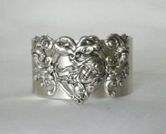 "This beautiful silver plated cuff bracelet has a silver plated art nouveau maiden and silver plated accents. 1.5\" wide." Victorian Silver Bracelets For Wedding, Victorian Silver Wedding Bracelets, Handmade Victorian Sterling Silver Bracelets, Handmade Victorian Sterling Silver Bracelet, Handmade Antique Silver Cuff Bracelet For Wedding, Handmade Victorian Cuff Bracelet For Wedding, Ornate Silver Cuff Bracelet For Anniversary, Antique Silver Cuff Bracelet As Gift, Unique Antique Silver Bracelet For Wedding