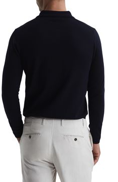 Fine-gauge wool provides luxe comfort in a trim polo knit with long sleeves that layers easily and looks splendid on its own. 26 1/2" length (size Medium) Point collar Long sleeves 100% wool Dry clean or hand wash, dry flat Imported Classic Wool Turtleneck With Ribbed Cuffs, Classic Wool Turtleneck With Ribbed Collar, Wool Turtleneck With Ribbed Collar And Long Sleeves, Merino Wool Fine Knit Turtleneck For Layering, Fine Knit Merino Wool Turtleneck For Layering, Classic Wool Crew Neck Polo Sweater, Classic Wool Polo Sweater With Crew Neck, Navy Long Sleeve Polo Sweater For Winter, Classic Long Sleeve Cashmere V-neck Sweater