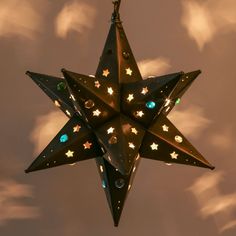 a lighted star hanging from the ceiling