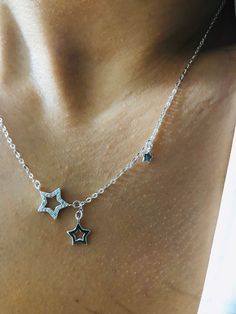 925 Sterling silver & clear cz crystal encrusted Star outlines necklace MATERIAL : 925 Sterling Silver SILVER WEIGHT : 1.55 g PART SIZE : 13 mm x 13 mm CHAIN : Length : 45 cm, Thickness : 1 mm CUBIC ZIRCONIA : Nr. of Stones : 30 | Setting : Handmade Prong Setting A cut out star encrusted with clear cubic zircona crystal provides the sparkle in this necklace. All made from sterling silver, the stars hang from a chain that measures 45cm  long (including spring ring). All ready in a gift pouch read Star Outline, Crystal Stars, Necklace Dainty, Dainty Necklace, Necklace Gift, Spring Rings, Luxury Jewelry, Gift Necklace, Prong Setting