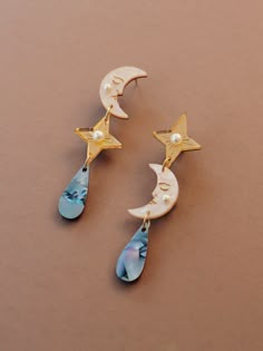 Asymmetric statement clip-on earrings with moon, star and teardrop motifs. Handmade in our North London studio. Wolf And Moon Jewellery, Moon Phase Earrings, Mother Of Pearl Meaning, Witchy Earrings, Playful Jewelry, Celestial Earrings, Pearl Details, Wolf Moon, Earrings Clip