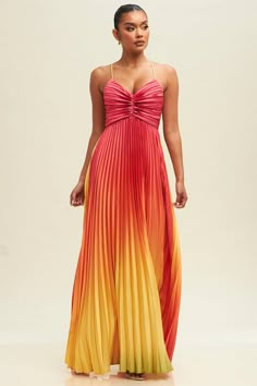 The Ombre Pleated Maxi Dress features a high-quality pleated fabric that offers you lasting comfort. It's lightweight design and adjustable waist make it an effortless fit for any body type. The flowy design allows you to move freely and confidently. 100%Polyester Bright Flowy Dress, Beach Bridesmade Dresses, Long Spring Dresses Formal, Sunset Ombre Bridesmaid Dresses, Ombre Pleated Dress, Prom Dresses Multicolor, Multicolored Prom Dress, Pink Yellow Orange Bridesmaid Dresses, Sunset Prom Dress