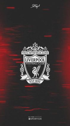 the liverpool football club logo is shown in red and black, while it appears to be blurry