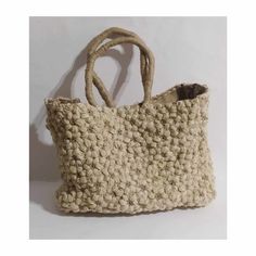 Handmade, tote bag, made with with two coloured natural jute and burlap inside.It is hand crocheted,in a puff flower pattern, it has a magnetic clasp closure and an inner pocket, with zipper. A unique beach bag,quite big,that you can use as a shopping bag as well, through spring and summer. A very stylish and eco-friendly gift for youself or someone you love, a bag that you will have for many,many years. Weight:1350 gr Dimentions: 40*30*12cm Handmade Eco-friendly Canvas Bag For Summer, Handmade Beige Summer Shoulder Bag, Handmade Beige Eco-friendly Crochet Bag, Neutral Straw Beach Bag With Handles, Eco-friendly Handmade Jute Shoulder Bag, Handmade Beige Shoulder Bag For Beach, Handmade Beige Shoulder Bag For Summer, Eco-friendly Sand Colored Tote Beach Bag, Eco-friendly Sand-colored Tote Beach Bag