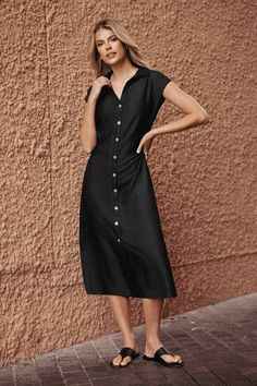 The Black Collared Front Button Midi Dress features a sleek collar and a streamlined midi length for a look that's effortlessly sophisticated. Product code: CAA05B4F004AA Features:  Woven Collared neckline Cap sleeves Front buttons  Maxi Wash Method: Regular Wash Material: 70%RAYON,30%POLYESTER. Classic V-neck Midi Dress With Buttons, Classic V-neck Shirt Dress With Button Closure, Single Breasted Midi Length Dresses, Single-breasted Midi Dress, Sleek Midi Dress For Date Night, Single-breasted Solid Dress, Black Collared Midi Dress For Summer, Mid-length Midi Dress With Button Closure For Work, Collared Black Midi Dress For Summer