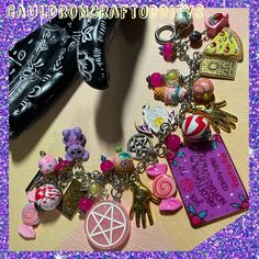 Welcome to my shop!  Here I've made a super chunky yet lightweight charm bracelet in Girlcore Spooky Slumber Party theme!  Inspired by girl gangs!  Silver tone 8" steel chain with an easy to use circle and bar toggle closure. Features pink, purple, and both gold and silver tone charms.  Friends circle round for answers and scares!  A night full of ouija boards, pizza, teddy bears, tarot, and candy...   Pink pentacles, iridescent candy beads, gold toned palm reader and tarot card charms, ice crea Whimsical Handmade Jewelry For Cosplay, Handmade Whimsical Jewelry For Cosplay, Pink Charms Bracelets Novelty Style, Pink Novelty Bracelets With Charms, Customized Pink Novelty Jewelry, Adjustable Pink Jewelry For Cosplay, Harajuku Style Halloween Jewelry Gift, Handmade Pink Jewelry For Halloween, Pink Themed Adjustable Charm Bracelet