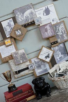 several pictures are hanging on the wall above a basket and other items in front of them