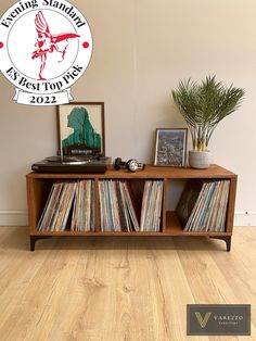 a record player is sitting on top of a shelf with records in front of it