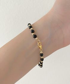 "GF Yellow Gold Genuine Black Onyx Bead Bracelet . The Leading Trend In Jewelry This Minimalist Bracelet Is Perfect For Layering With Your Other Favorite Bracelets. This Bracelet Makes A Great Gift For Any Occasion. Jewelry Comes In A Cute Gift Box ready To Present. - Made To Order... Let Me Know What length You Would Be Interested In Product Detail: Stone: genuine black onyx Width: 4mm Length: 6\" 6.5\" 7\" 7.5\" 8\" 8.5\" 9\" Closure: gf yellow gold spring ring ✨ Feel Free To Let Me Know Any Q Black Crystal Bracelet With Spacer And Round Beads, Black Crystal Bracelet With Spacer Beads, Black Bracelets With Spacer Beads, Black Beaded Bracelet With Tiny Beads As Gift, Adjustable Black Pearl Bracelet, Everyday Black Jewelry With Lobster Clasp, Dainty Black Beaded Bracelets With Tiny Beads, Elegant Black Rosary Bracelet With Round Beads, Black Jewelry With Lobster Clasp And Round Beads