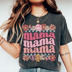 Retro Floral Mama T-shirt Gift for Mom Shirt for Mother's Day Mama T-shirt Botanical Shirt for Mom Smiley Mother's Day Shirt Gift for wife  *Please size up 1-3 sizes if you would like the oversized look! UNISEX SHIRTS SIZES: The models in the photo images are wearing 1 or 2 sizes up, so please order 1 or 2 sizes up for an oversized look. Many customers say that it's only a bit oversized look or true to size for women's size when you choose your normal women's size. PRINTS: We use high quality Direct-to-garment (DTG) printing! DTG printing method is used for printing on clothing, and the process itself resembles digital printing on paper. DTG printing produces professional high quality design.  SOFTNESS: When you receive it, the shirt looks a little stiff, but after washing over the time it Pink Graphic Print T-shirt For Mother's Day, Mother's Day Graphic Tee With Funny Text, Funny Relaxed Fit Top With Custom Print, Mother's Day Funny Text Graphic Tee, Funny Graphic Print T-shirt For Mother's Day, Funny Mother's Day Graphic Print T-shirt, Funny Mother's Day Graphic T-shirt, Funny Print T-shirt For Mother's Day, Funny Pre-shrunk Tops For Mother's Day