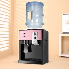 a pink and black water dispenser sitting on top of a counter