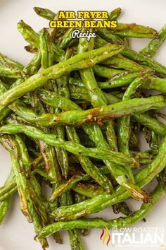 cooked green beans on a white plate