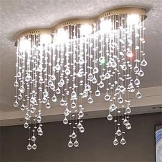 a chandelier hanging from the ceiling in a room