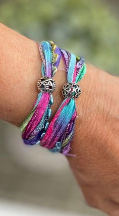 This Charm Bracelets item by AmysAccessoriesLLC has 19 favorites from Etsy shoppers. Ships from Wheaton, IL. Listed on Sep 26, 2024 Fabric Bracelets Diy, Silk Wrap Bracelets, Boho Jewelry Diy, Ribbon Ideas, Sari Ribbon, Ribbon Bracelets, Silk Jewelry, Fabric Bracelets, Fabric Jewellery