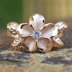 Material:  .925 Sterling Silver  Sizes available: 3-10  Band Width:  12mm Quantity:  1 Ring/Band Rose Gold Flower Ring For Promise, Rose Gold Flower Promise Ring, Hawaiian Wedding Rings, Hawaiian Heirloom Jewelry, Leaf Wedding Band, Pink Gold Rings, Heirloom Jewelry, Hawaiian Jewelry, Custom Wedding Rings