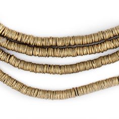 "Take a look at this great strand of brass beads fashioned in a special heishi shape similar to potato crisps. Each strand is 25 long with beads measuring approximately 1 x 4mm. These great beads are highly versatile and may be used as spacers or accents in your unique designs. A great addition to your beading toolkit! Multiple strands pictured. Each strand sold individually. Bead Size: 1 x 4mm Strand Length: 25\" Approximate # of Beads: 1200 Hole Size: 1mm MORE BRASS BEADS AVAILABLE Browse our African Brass Beads, Potato Crisps, Master Board, Flat Shapes, Gold Flats, Unique Jewelry Designs, Heishi Beads, Creative Jewelry, Tube Beads