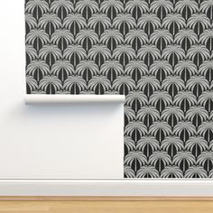 an art deco style wallpaper with black and white fan pattern on the back side