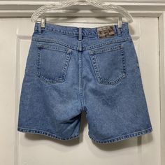 Vintage 90s/Y2k St Johns Bay Relaxed Fit Denim Shorts Tag says size 10.  Made in Nicaragua.  100% cotton.  In good shape no rips or stains that I can find.  The waist measures 16'' flat across and the length from waist to bottom along the side is 18''.  The inseam is 7'' and the rise is 12''. Y2k Cotton Jean Shorts With Pockets, Y2k Style Cutoff Cotton Jeans, Y2k Cotton Cutoff Jeans, Y2k Style Cotton Cutoff Jeans, 90s Style Cotton Straight Leg Shorts, 90s Style Straight Leg Cotton Shorts, Y2k High Rise Cotton Shorts, Y2k Mid-rise Cotton Shorts, Y2k Style Mid-rise Cotton Shorts