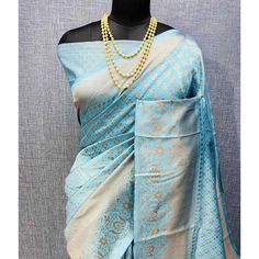 Light Blue colored saree is made from banarasi silk fabric which is highlighted with beautiful weaving work as shown. Comes along with unstitched banarasi silk blouse piece which you can customise as per your design/style. Occasion - You can wear this saree for festivals and functions. Note:- the actual product may differ slightly in color and design from the one illustrated in the images when compared with computer or mobile screen. Measurements: Saree : Banarasi Silk : 5.5 Mtrs Blouse : Banarasi Silk : 0.8 Mtr Material: Banarasi Silk Stitch Type: Unstitched Country of Origin: India Care Guide: Dry Clean Blue Slub Silk Traditional Bollywood Wear, Blue Katan Silk Pre-draped Saree With Zari Work, Blue Jamawar Pre-draped Saree With Zari Weaving, Blue Bollywood Banarasi Silk Pre-draped Saree, Blue Pre-draped Saree With Zari Weaving, Light Blue Semi-stitched Saree With Traditional Drape, Blue Unstitched Slub Silk Blouse Piece, Blue Slub Silk Unstitched Blouse Piece, Designer Blue Raw Silk Pre-draped Saree